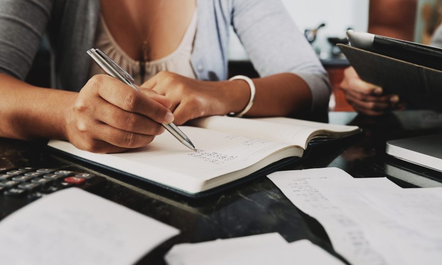 Cropped image of woman analyzing budget and counting income